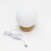 New wave lamp moon is a white spherical lamp with a wooden base and usb charging cable for easy use