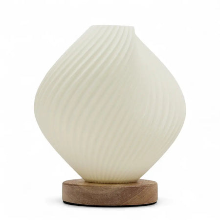 Cream-colored ribbed glass new wave lamp shell twisted with a wooden base for stylish home lighting