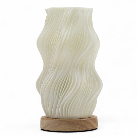 New wave lamp star twisted with cream ceramic wave pattern and natural wood base on a plain background