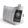 A light blue and white indigo echo toiletry bag made of textured indian jacquard with a gold-tone zipper pull