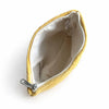 A cozy mustard-yellow jacquard toiletry bag with silver zipper and white lining for everyday essentials by marigold loom