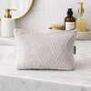 Light gray quilted jacquard toiletry bag with moonlit weave pattern and gold zipper for makeup or travel use