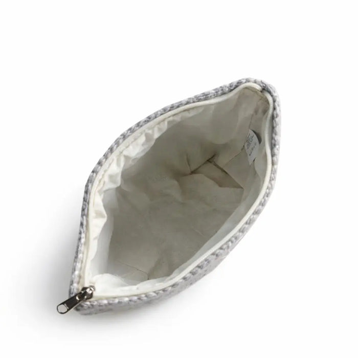 Gray jacquard toiletry bag with silver zipper white interior featuring moonlit weave fabric pouch