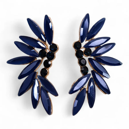 Deep blue leaf-shaped stud earrings with gold tone base and black stones in royal blue nymph aurora glass design