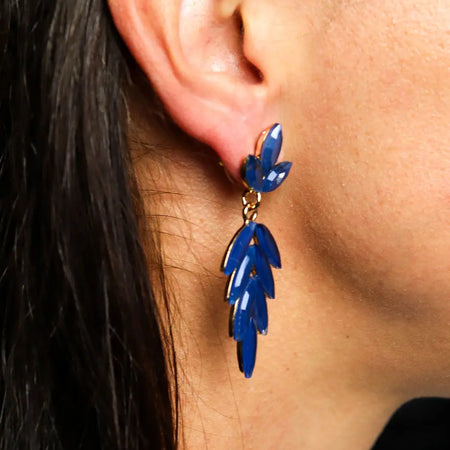 Vibrant cobalt blue long drop nymph aurora glass earrings with gold tone clasp in royal blue leaf shape