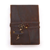Brown oiled leather journal with deckled edges and a vintage key charm attached to its strap 7 by 5 inches