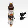 A brown glass bottle of organic hair serum with carrot seed and organic castor infused black dropper cap label