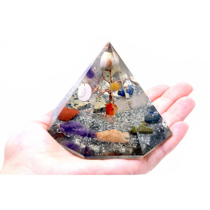Orgonite 7-sided clear resin pyramid with colorful stones and a miniature gemstone wisdom tree inside