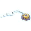 A translucent purple and gold resin orgonite power keyring with a detailed amethyst mandala design and embedded crystals