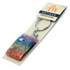 A rectangular rainbow-colored resin orgonite power keyring with a golden spiral design for home protection and chakra balance