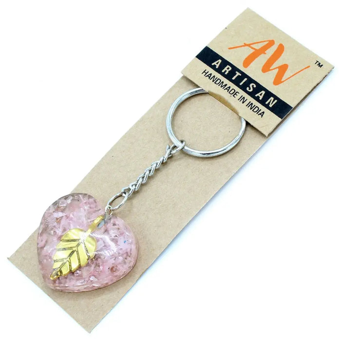 Orgonite power keyring showing a pink resin heart with gold leaf accent made of metal and resin materials