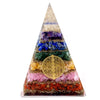 A clear resin orgonite pyramid with seven colorful crystal layers and flower of life design large size