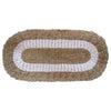Beige and white braided oval seagrass rug with textured woven design for natural decor settings