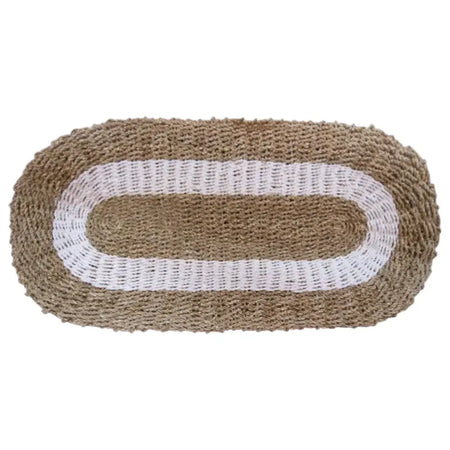 Beige and white braided oval seagrass rug with textured woven design for natural decor settings