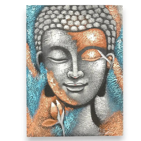 A textured canvas painting of a serene buddha face with silver and rose gold flower accents on a teal background