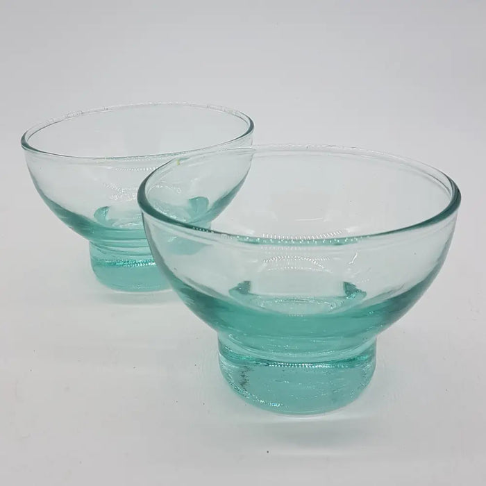Pair of clear turquoise recycled glass bowls with hand blown textured bubble base and smooth rim