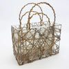 A pair of wirework baskets with transparent glass, brown twine handles, and silver wire mesh for plants or christmas decor