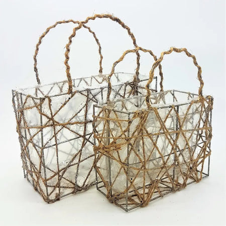 Two rustic wirework baskets with clear glass inserts and twisted jute handles for plants or christmas decorations
