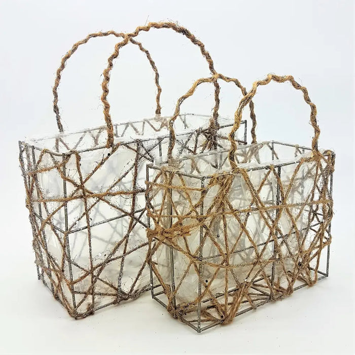 Two rustic wirework baskets with clear glass inserts and twisted jute handles for plants or christmas decorations