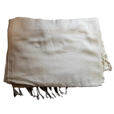 Beige woven textile blanket with fringed edges shown alongside a pale blue wool blend pashmina shawl