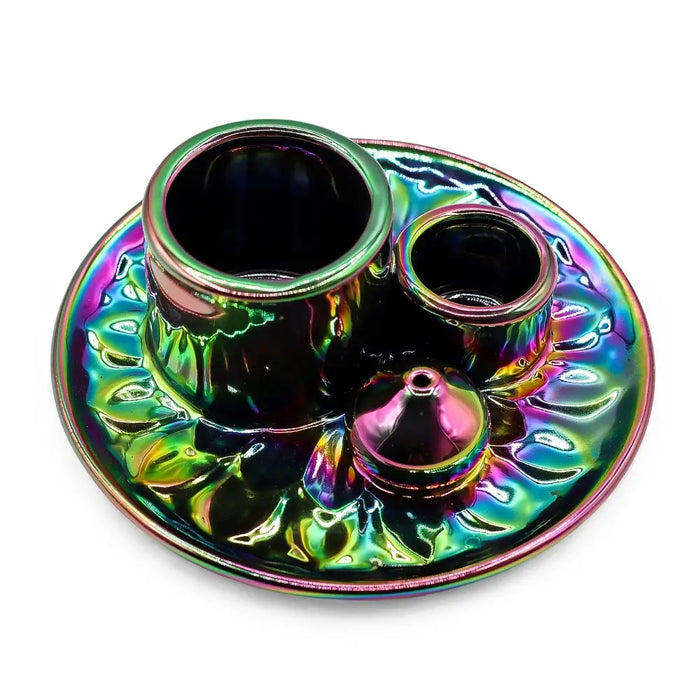 Iridescent metallic palo santo stick and smudge holder set with two holders and a cone on a mandala tray