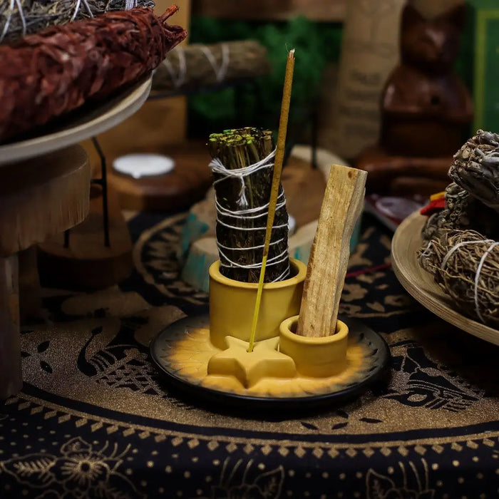 Yellow ceramic smudge holder with star base and two compartments for palo santo sticks and sage bundles