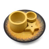 Yellow ceramic pet feeder with two bowls and star divider on sunflower base paired with palo santo stick smudge holder