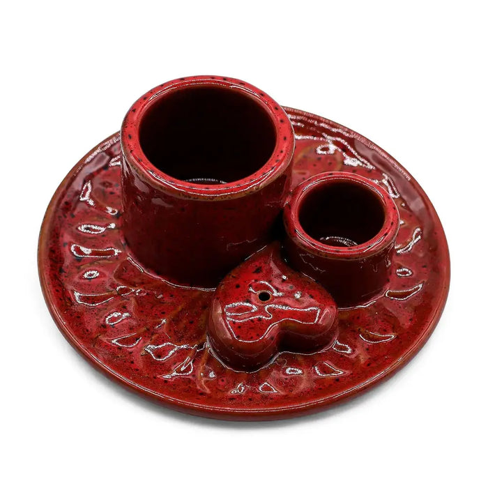 Red ceramic palo santo stick and smudge holder with two cylindrical holders and a heart-shaped centerpiece