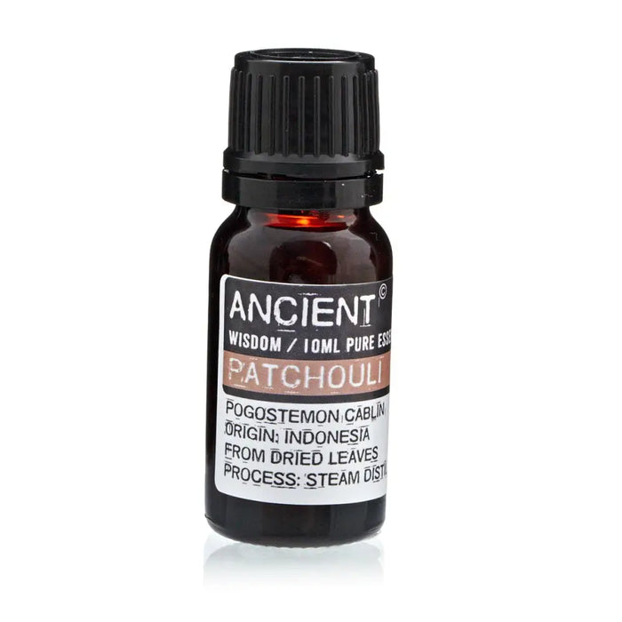 A dark amber glass bottle of patchouli oil pogostemon cablin with black cap using steam distillation method