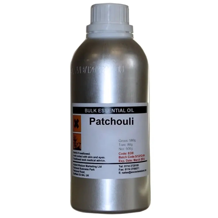 Silver metallic bottle of patchouli essential oil 500ml with white cap and label showing finest patchouli leaves info