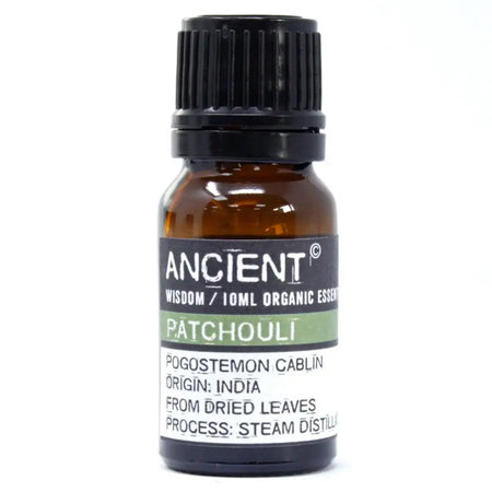 A small amber glass bottle with black cap labeled ancient wisdom patchouli organic essential oil 10ml by ancient