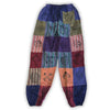 Purple patchwork harem pants with embroidered mushroom and floral designs in various fabric textures, size L XL