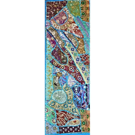 Patchwork wall hanging and table runner with paisley and geometric patterns in blue purple gold and green fabric