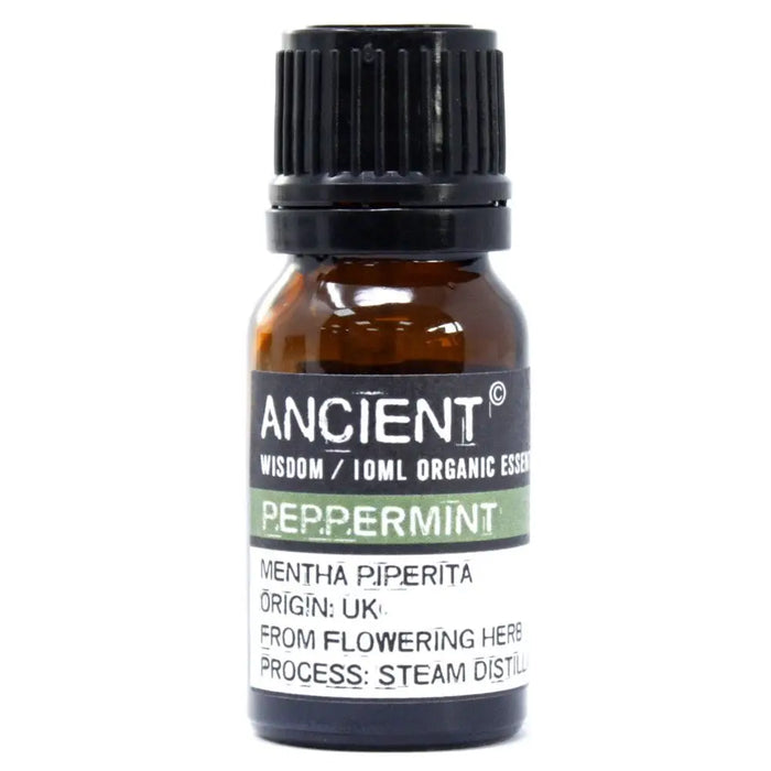 A small amber glass bottle with a black cap of peppermint organic essential oil to alleviate symptoms and allergen declarations