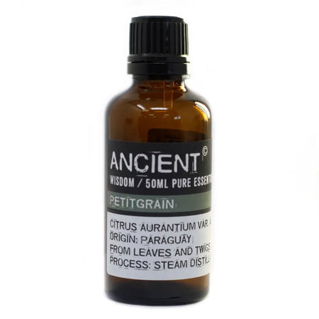 A 50ml amber glass bottle of ancient wisdom petitgrain essential oil with black cap and label showing citrus from paraguay