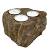 Natural stone petrified wood tealight holder with three circular indentations holding white tea light candles