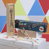 Wooden box with colorful striped pick up sticks for the classic pick up sticks game set
