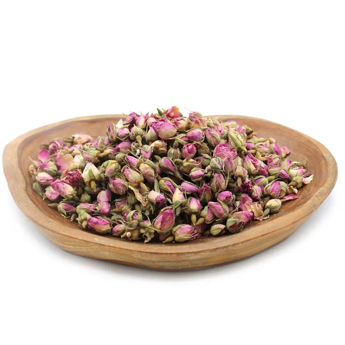 A wooden bowl filled with dried pink and green rose buds weighing 0.5kg for herbal use and decoration