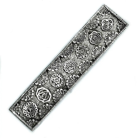 Silver-toned rectangular polished aluminium incense holder with embossed floral and geometric patterns for stick incense