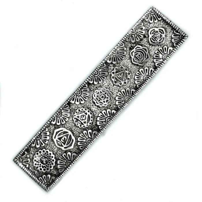 Silver-toned rectangular polished aluminium incense holder with embossed floral and geometric patterns for stick incense