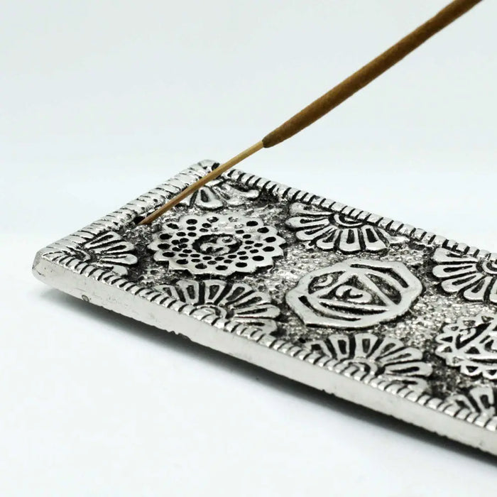 Silver polished aluminium incense holder with intricate floral and geometric patterns for stick incense use