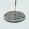 Polished aluminium silver-toned circular incense holder with flower of life pattern and central hole for incense stick