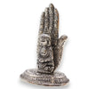 Silver-colored polished aluminium incense holder with buddha figurine seated inside an ornately carved hand