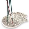 Polished aluminium incense holder shaped like a large silver hamsa hand with intricate floral and geometric embossing