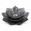 Black metal lotus-shaped incense holder with detailed petal carvings and central hole made of polished aluminium