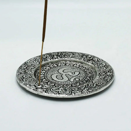 Silver-toned round polished aluminium incense holder with om symbol and intricate paisley mandala patterns