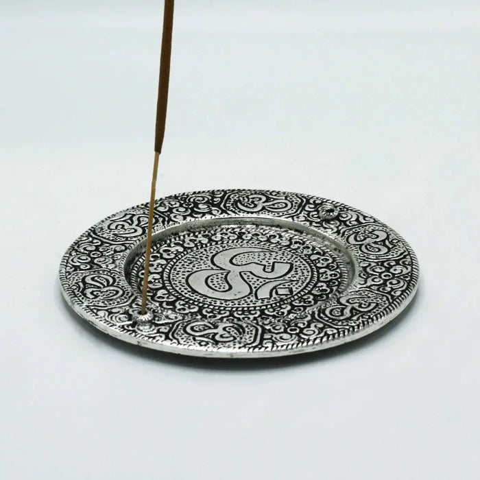 Silver-toned round polished aluminium incense holder with om symbol and intricate paisley mandala patterns