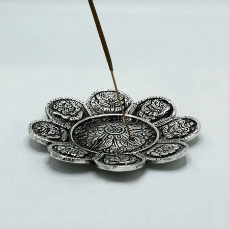 Silver floral incense burner with intricate petal engravings and central pattern in polished aluminium finish