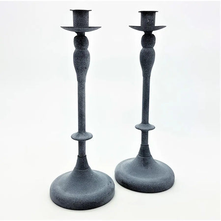 Pair of grey metal candlestick holders with dark powdered finish and classic tapered design with flared bases