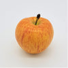 A premium artificial fruit coxs orange pippin apple with glossy golden yellow skin, red streaks, and a dark brown stem